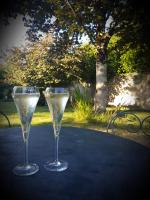 two glasses of white wine sitting on a table at La Maison Bizienne Guérande in Guérande