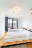 A bed or beds in a room at easy flat Margareten Apartments
