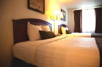 a hotel room with two beds and a window at Bryce View Lodge Part of the Ruby's Inn Resort in Bryce Canyon