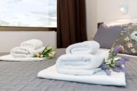 Posteľ alebo postele v izbe v ubytovaní Apinelo Tower Rooms