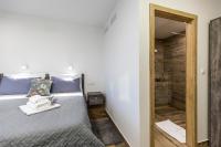 Posteľ alebo postele v izbe v ubytovaní Apinelo Tower Rooms