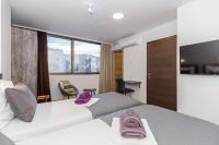 Posteľ alebo postele v izbe v ubytovaní Apinelo Tower Rooms