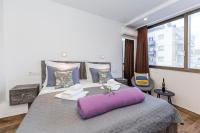 Posteľ alebo postele v izbe v ubytovaní Apinelo Tower Rooms