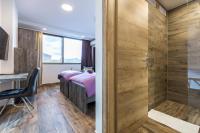 Posteľ alebo postele v izbe v ubytovaní Apinelo Tower Rooms
