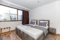 Posteľ alebo postele v izbe v ubytovaní Apinelo Tower Rooms
