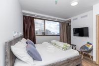 Posteľ alebo postele v izbe v ubytovaní Apinelo Tower Rooms