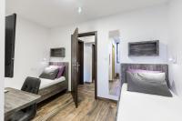 Posteľ alebo postele v izbe v ubytovaní Apinelo Tower Rooms