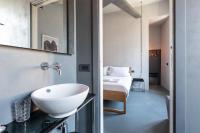 A bed or beds in a room at Pietra - The Italian Stay Collection