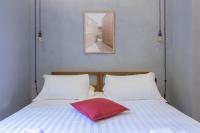A bed or beds in a room at Pietra - The Italian Stay Collection