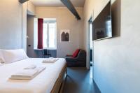 A bed or beds in a room at Pietra - The Italian Stay Collection