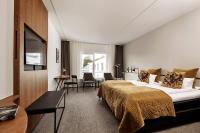 Ein Bett oder Betten in einem Zimmer der Unterkunft Comwell Borupgaard