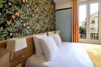 Hôtel de France, un hôtel AMMIにあるベッド