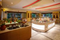 a restaurant with a food counter in a building at Pantheon Hotel in Rethymno Town
