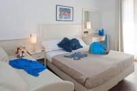 Posteľ alebo postele v izbe v ubytovaní Hotel Fra I Pini