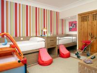 A bed or beds in a room at Princesa Yaiza Suite Hotel Resort