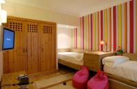 A bed or beds in a room at Princesa Yaiza Suite Hotel Resort