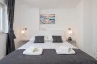 Posteľ alebo postele v izbe v ubytovaní S & V Deluxe Apartments