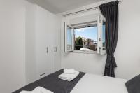 Posteľ alebo postele v izbe v ubytovaní S & V Deluxe Apartments