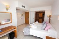 Postel nebo postele na pokoji v ubytování Hotel Timor
