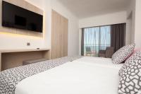 Postel nebo postele na pokoji v ubytování Hotel Timor