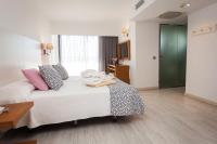 Postel nebo postele na pokoji v ubytování Hotel Timor