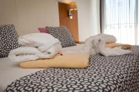 Postel nebo postele na pokoji v ubytování Hotel Timor