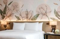 Postel nebo postele na pokoji v ubytování Sivatel Bangkok Hotel