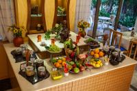 a table with a bunch of fruits and vegetables on it at Pantheon Hotel in Rethymno Town