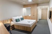 Postel nebo postele na pokoji v ubytování Hotel D1