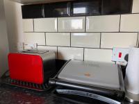 Kuchyň nebo kuchyňský kout v ubytování Eskdaill Place Apartment
