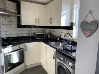 Kuchyň nebo kuchyňský kout v ubytování Eskdaill Place Apartment