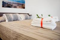 Posteľ alebo postele v izbe v ubytovaní Casa Vela Bianca Mondello Addaura
