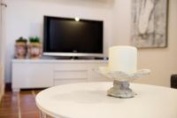 Televízia a/alebo spoločenská miestnosť v ubytovaní Casa Vela Bianca Mondello Addaura