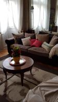 a living room with a couch and a coffee table at Au Nid de la Madeleine in Gaillac