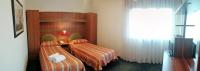 Łóżko lub łóżka w pokoju w obiekcie Hotel Kristall
