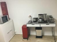 a kitchen with a table with a coffee maker on it at &quot;An der Lindenberganlage&quot; in Melsungen