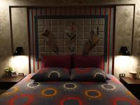 a bedroom with a bed with two pillows on it at Baan Baimai Boutique Room in Phra Nakhon Si Ayutthaya