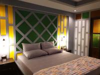 a bedroom with a bed with a green and yellow wall at Baan Baimai Boutique Room in Phra Nakhon Si Ayutthaya