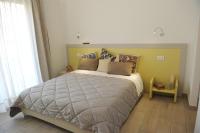 A bed or beds in a room at Il Granaio di Rossetti Elisabetta