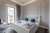 Posteľ alebo postele v izbe v ubytovaní Ambria Apartments Platan Complex