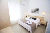 Łóżko lub łóżka w pokoju w obiekcie Hotel Verde Luna