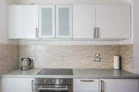 Kuchyň nebo kuchyňský kout v ubytování Apartmaji Tina