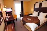 Best Western Plus La Fayette Hotel et SPA tesisinde bir odada yatak veya yataklar