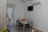 A television and/or entertainment centre at Rosy House - Hospitality