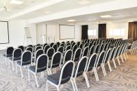 a room with rows of chairs in a classroom at Westotel Le Pouliguen in Le Pouliguen