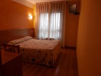 Postel nebo postele na pokoji v ubytování Hotel Doña Maria