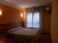 Postel nebo postele na pokoji v ubytování Hotel Doña Maria