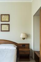 Łóżko lub łóżka w pokoju w obiekcie Hotel Beatrice
