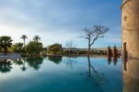 a pool of water with a tree in the middle at Hotel Rural Xereca in Puig D’en Valls