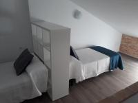 Posteľ alebo postele v izbe v ubytovaní Puerta Alameda Suites Mirador Centro Historico